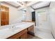 Traditional bathroom features white tile floors, a large mirror, and a combined shower and tub at 227 Eton Ct, Mableton, GA 30126