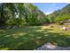 Lush neighborhood green space offering picnic tables and lots of space to run and relax at 227 Eton Ct, Mableton, GA 30126