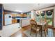 Dining room with a wood table set, hardwood floors, and adjacent kitchen at 227 Eton Ct, Mableton, GA 30126