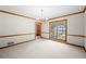 Bright dining room with chandelier, carpet and large window at 227 Eton Ct, Mableton, GA 30126