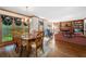 Dining room with a wood table set, hardwood floors, and natural light at 227 Eton Ct, Mableton, GA 30126