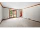 Bright living room with carpet, wood trim, and a large window at 227 Eton Ct, Mableton, GA 30126