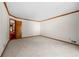 Neutral living room with carpet, wood trim, and an open doorway at 227 Eton Ct, Mableton, GA 30126