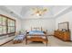 Bright main bedroom with a vaulted ceiling and large window, offering a relaxing retreat at 227 Eton Ct, Mableton, GA 30126