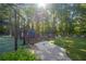 Charming community playground features a tennis court, play equipment, and picnic tables in this idyllic neighborhood at 227 Eton Ct, Mableton, GA 30126