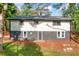 Back exterior of the home shows the walkout basement entrance and the expansive property behind the home at 474 Upper Burris Rd, Canton, GA 30114