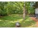 Large, level lot that backs up to mature trees offers privacy and ample space for outdoor activities at 474 Upper Burris Rd, Canton, GA 30114