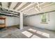 Unfinished basement with exposed beams and a concrete floor at 474 Upper Burris Rd, Canton, GA 30114