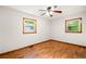 Bedroom with hardwood floors, neutral paint, and ample natural light at 474 Upper Burris Rd, Canton, GA 30114