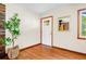 Bright entryway featuring hardwood floors and a decorative mirror near the front door at 474 Upper Burris Rd, Canton, GA 30114