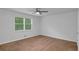 Spacious bedroom with carpet and a ceiling fan, providing a comfortable retreat at 6625 Peppermill Ln, South Fulton, GA 30349