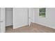 This carpeted bedroom has a closet, and a window for natural light at 6625 Peppermill Ln, South Fulton, GA 30349