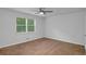 Spacious bedroom with a neutral color scheme and a ceiling fan for added comfort at 6625 Peppermill Ln, South Fulton, GA 30349