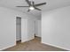 This bedroom features a ceiling fan, neutral carpeting, and a closet for storage at 6625 Peppermill Ln, South Fulton, GA 30349