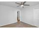 Carpeted bedroom includes a ceiling fan and a closet, with an open doorway at 6625 Peppermill Ln, South Fulton, GA 30349