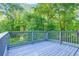 Enjoy the scenic view from this spacious deck, ideal for outdoor entertaining and relaxation at 6625 Peppermill Ln, South Fulton, GA 30349