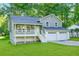Charming split-level home with a two-car garage, front porch, and well-manicured lawn at 6625 Peppermill Ln, South Fulton, GA 30349