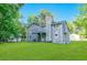 Charming home exterior with a private deck overlooking a lush backyard, offering serene outdoor living at 6625 Peppermill Ln, South Fulton, GA 30349
