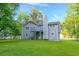 Home exterior featuring a well-maintained lawn and a private deck, perfect for outdoor enjoyment at 6625 Peppermill Ln, South Fulton, GA 30349