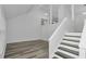 Bright living area with new floors and natural light, leading to the staircase at 6625 Peppermill Ln, South Fulton, GA 30349