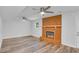 Bright living room showcases a fireplace, fan, and hardwood flooring for a cozy atmosphere at 6625 Peppermill Ln, South Fulton, GA 30349