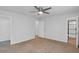 Spacious main bedroom includes a ceiling fan and doorways leading to the closet and bathroom at 6625 Peppermill Ln, South Fulton, GA 30349