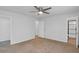 Spacious bedroom with neutral carpet and a ceiling fan at 6625 Peppermill Ln, South Fulton, GA 30349