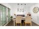 Bright dining room featuring a modern light fixture, a dining table, and lots of natural light at 6900 Roswell Rd # 3N, Atlanta, GA 30328
