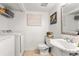 Cozy laundry room including a sink and washer and dryer at 6900 Roswell Rd # 3N, Atlanta, GA 30328
