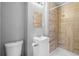 Cozy bathroom with marble-style shower and flooring, modern vanity, and updated fixtures at 765 Shellnut Dr, Forest Park, GA 30297