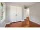Cozy bedroom featuring hardwood floors, a large closet, and natural light from the window at 765 Shellnut Dr, Forest Park, GA 30297