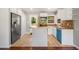 Bright kitchen featuring white cabinets, butcher block countertops, stainless steel appliances, and a blue dishwasher at 765 Shellnut Dr, Forest Park, GA 30297