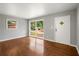 Bright living room featuring hardwood floors and large windows with natural light at 765 Shellnut Dr, Forest Park, GA 30297