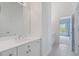 Bright bathroom featuring a white vanity and mirror, complemented by a light gray tiled floor at 100 Braxton Way, Roswell, GA 30075