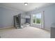Spacious bedroom featuring a gray bunk bed with stairs and a window providing natural light at 100 Braxton Way, Roswell, GA 30075