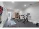 Well-equipped home gym features modern exercise equipment including a treadmill, bike and sauna at 100 Braxton Way, Roswell, GA 30075