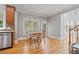 Spacious eat-in kitchen featuring stainless steel appliances and a view to the stairs and living room at 100 Braxton Way, Roswell, GA 30075