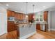 Stunning kitchen with stainless steel appliances, hardwood floors, and white base cabinetry at 100 Braxton Way, Roswell, GA 30075