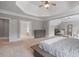 Spacious bedroom with a tray ceiling, complemented by large windows for natural light at 100 Braxton Way, Roswell, GA 30075