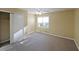 Bedroom with a window letting in natural light, a ceiling fan, and a closet at 1003 Wiley Bridge Rd, Woodstock, GA 30188