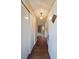 Inviting foyer with hardwood floors, stylish light fixture, and views of the living room with fireplace at 1003 Wiley Bridge Rd, Woodstock, GA 30188