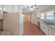 Bright kitchen featuring white cabinets, stainless steel appliances, and durable tile flooring at 1003 Wiley Bridge Rd, Woodstock, GA 30188
