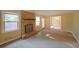 Inviting living room with a brick fireplace, bright windows, and comfortable carpet at 1003 Wiley Bridge Rd, Woodstock, GA 30188