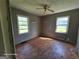 Bedroom with hardwood floors, and windows at 1243 Hill Nw St, Conyers, GA 30012