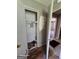 A walk-in closet featuring wall repairs and doorway views at 1243 Hill Nw St, Conyers, GA 30012