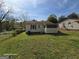 View of the home exterior and backyard area at 1243 Hill Nw St, Conyers, GA 30012