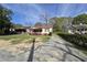 Charming bungalow-style home with a covered porch and spacious driveway on a sunny day at 1243 Hill Nw St, Conyers, GA 30012