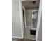 Hallway view showcasing access to the bathroom and other rooms at 1243 Hill Nw St, Conyers, GA 30012