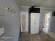 Kitchen area with built-in storage and access to the hallway, awaiting updates at 1243 Hill Nw St, Conyers, GA 30012