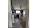 Outdated kitchen featuring dark cabinets, a white refrigerator, and a gas stove at 1243 Hill Nw St, Conyers, GA 30012
